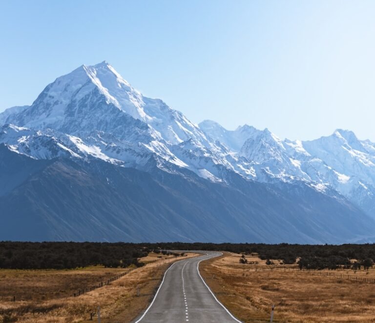 mountains covered with snow near road