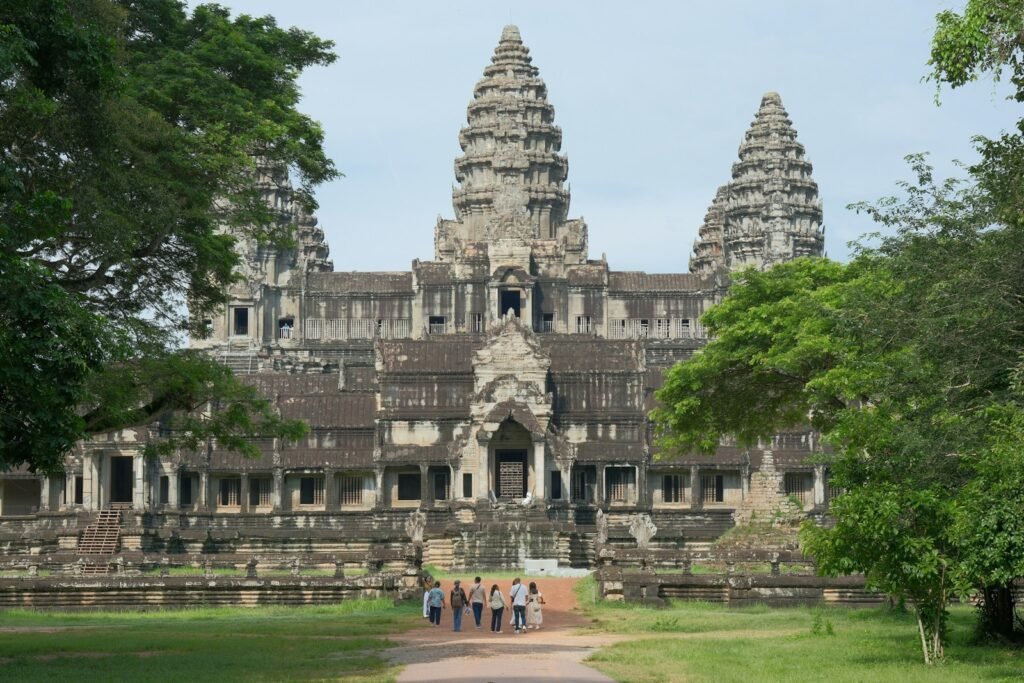 A group of people standing in front of a large building