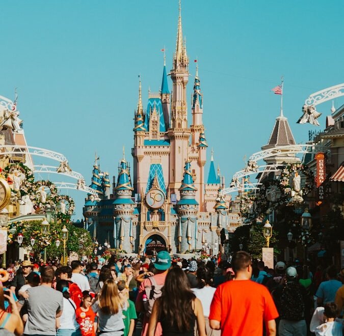 a crowd of people in front of a castle