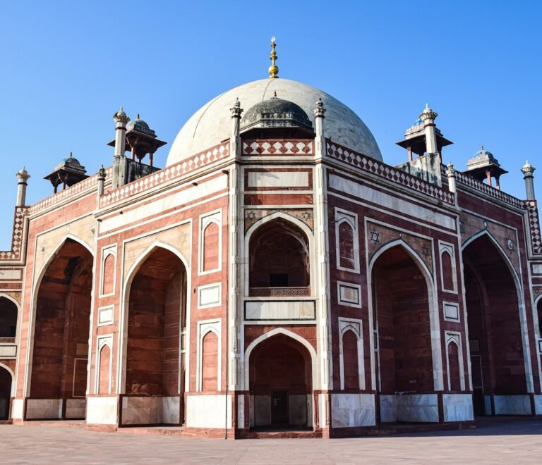 a red and white building with a dome on top