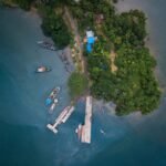 a small island with several boats in the water