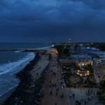 A view of a beach at night from a high point of view