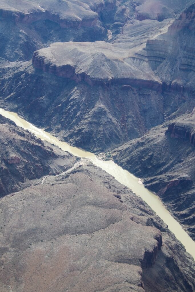 An aerial view of a river running through a canyon