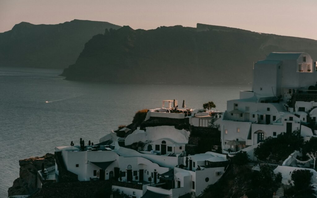 a group of buildings by a body of water